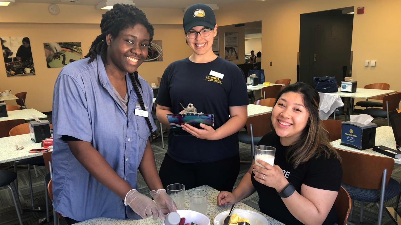Undergraduate research interns Adaeze Ezeagwula, Jewel Esparza, Melanie Hercules (left to right) measuring dietary intake of study participants at Cuarto Dining Commons